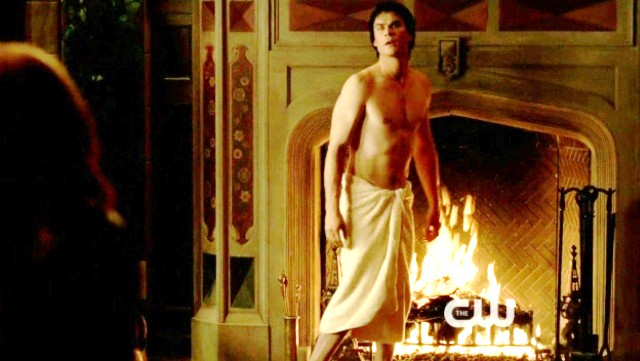 Shirtless Ian Somerhalder is wrapped in a towel and all toasty by the fire
